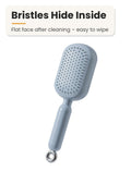 La Basera blue self-cleaning hair brush with bristles retracted