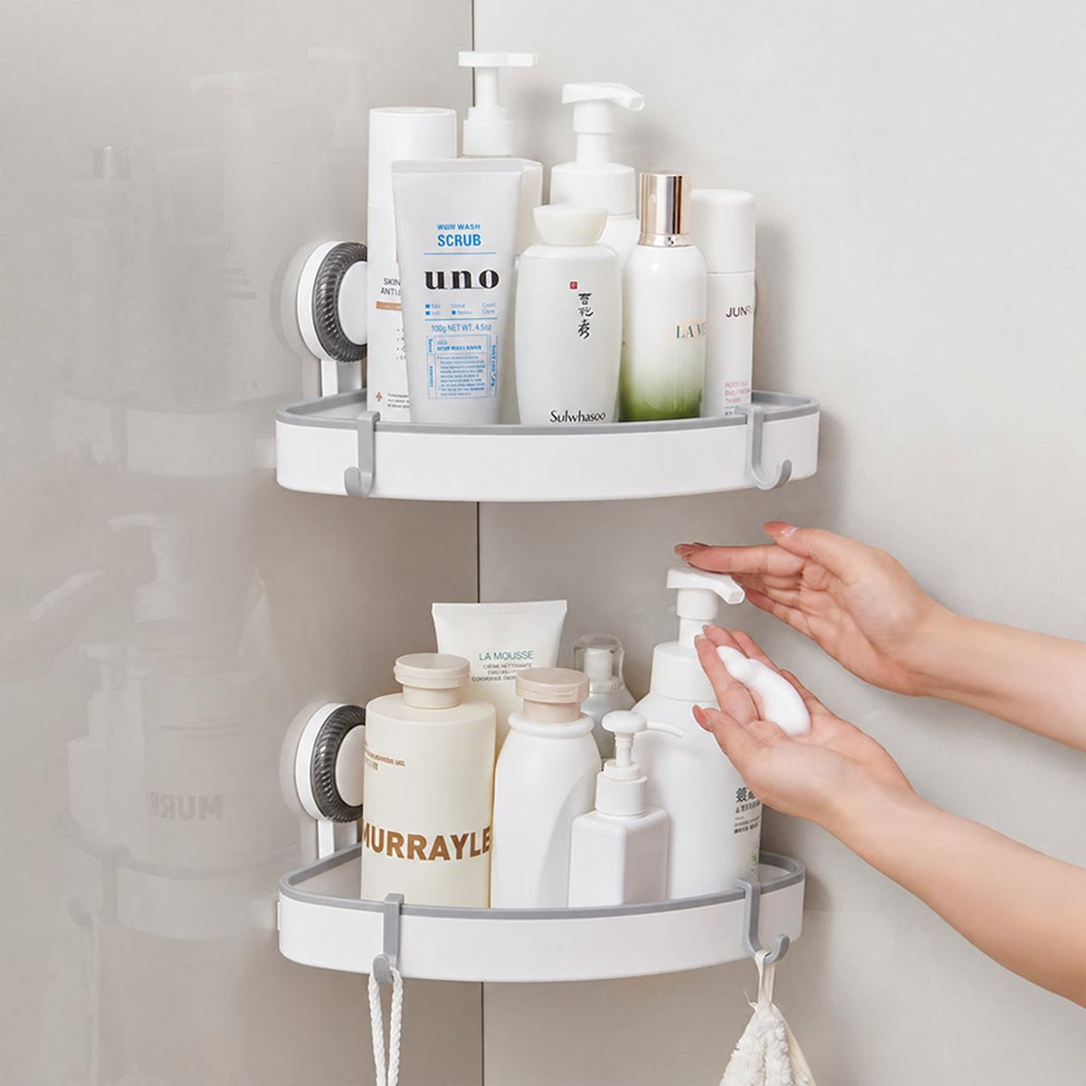 Two-tier corner shelf with skincare products and hooks for loofah
