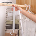 La Basera pant rack, grey strip, rotating hook hung vertically